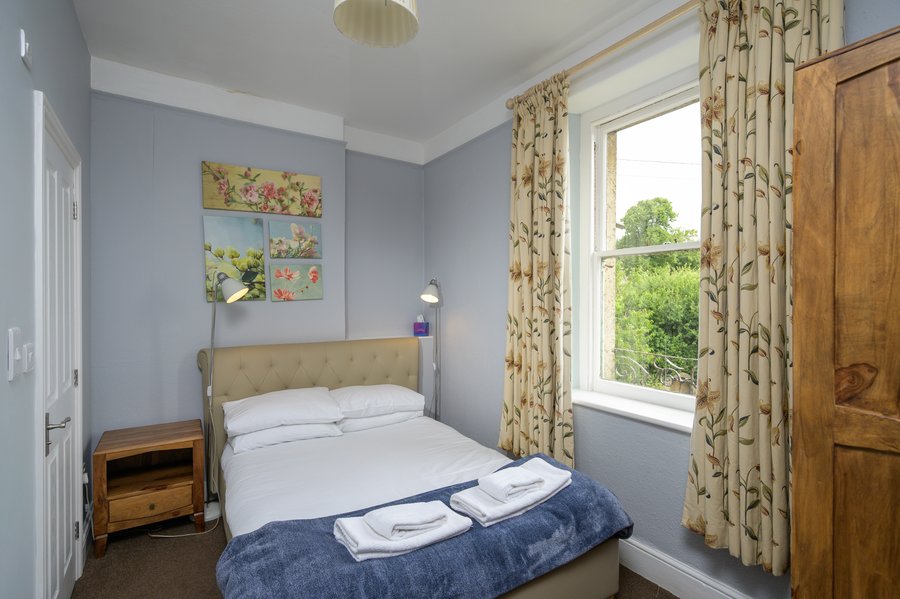 A bedroom with countryside views